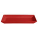 A red G.E.T. Enterprises Bugambilia rectangular platter with a textured surface.
