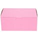 A pink rectangular bakery box with a lid.