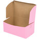 A pink open bakery box with a lid.