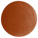 A brown round disc with specks on a white background.