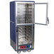 A blue and silver Metro C5 heated holding and proofing cabinet with clear Dutch doors open.