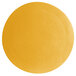 A close-up of a yellow surface with a textured finish in a circular shape.