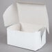 A white 5 1/2" x 4" x 3" cake box with an open lid.