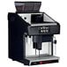 A black and silver Grindmaster espresso machine with milk delivery.