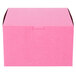 A pink bakery box with a lid.
