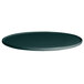 A forest green G.E.T. Enterprises Bugambilia resin-coated aluminum round disc with a rim on a table.