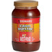 A bottle of Cajun Injector Hot 'n Spicy Butter Marinade.