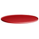 A cranberry red G.E.T. Enterprises Bugambilia round metal tray with a rim.