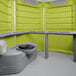 A lime green PolyJohn wheelchair accessible portable restroom with a grey toilet and black lid.