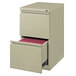 A Hirsh Industries putty mobile pedestal file cabinet with an open file drawer.