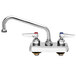 A chrome T&S deck-mounted workboard faucet with red and blue knobs.