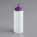 A white plastic bottle with a purple lid and a pointy tip.