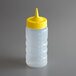 A clear plastic Vollrath squeeze bottle with a yellow lid.