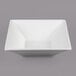 A white square G.E.T. Enterprises Bugambilia bowl with a textured design.