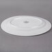 A white Libbey porcelain platter with a circular design on it.