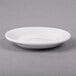 A white Libbey porcelain plate with a rim.