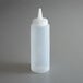 A clear plastic Vollrath squeeze bottle with a white lid.
