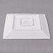 A white square Libbey porcelain plate with a square center.