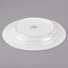 A white Libbey porcelain plate with a circular design on it.