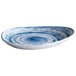 A close up of a blue and white Elite Global Solutions Van Gogh Oval Melamine Plate with a swirl design.