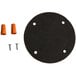 A black circle with orange caps and screws.