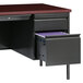 A black Hirsh Industries left corner pedestal desk with a drawer and file cabinet.