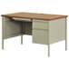 A Hirsh Industries oak pedestal desk with drawers and a light brown top.