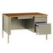 A Hirsh Industries single pedestal desk with a drawer and file cabinet.