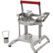 A Vollrath Redco InstaBloom II Onion Cutter, a metal machine with a red handle.