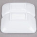 A white foam container holding two white rectangular melamine sauce dishes.
