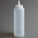 A clear plastic Vollrath squeeze bottle with a white cap.