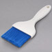 A blue Carlisle Sparta Spectrum pastry brush with a white handle.