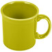 A close-up of a yellow Fiesta Java mug with a handle.