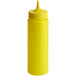 A yellow plastic Vollrath Traex squeeze bottle with a single tip lid.