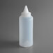 A clear plastic Vollrath squeeze bottle with a white cap.