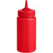 A Vollrath Traex red plastic squeeze bottle with a wide mouth and single tip.