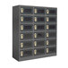 A black Winholt smart locker with perforated doors and electrical outlets with many compartments.