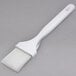 A Carlisle white nylon bristle pastry brush with a hook.