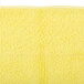 A yellow Unger SmartColor microfiber cloth.