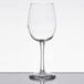 A clear Libbey Vina wine glass with a long stem on a reflective surface.