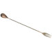 An antique copper-plated Barfly stainless steel bar spoon with a fork end.