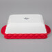A white and red rectangular Tuxton casserole dish box.