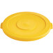 A yellow plastic lid with a circle on top.