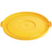 A yellow plastic lid for a Lavex 32 gallon round commercial trash can.