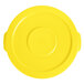 A yellow plastic lid for a Lavex commercial trash can.