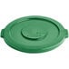 A green plastic lid for a Lavex round commercial trash can with a round hole.
