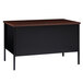 A black and brown Hirsh Industries single pedestal desk with a drawer.