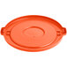 An orange plastic Lavex lid for a round commercial trash can with a handle and circle.