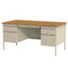 A Hirsh Industries double pedestal desk with drawers and a wooden top.