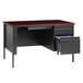 A charcoal Hirsh Industries single pedestal desk with a drawer and file cabinet.